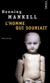 Couverture L'homme qui souriait Editions Seuil (Policiers) 2014